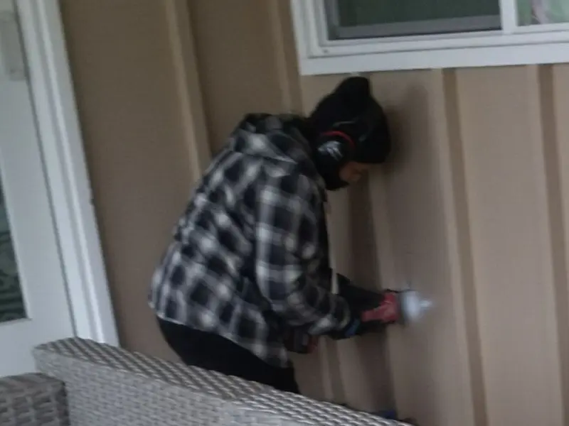 Professional electrician installing an exterior outlet in Pell City